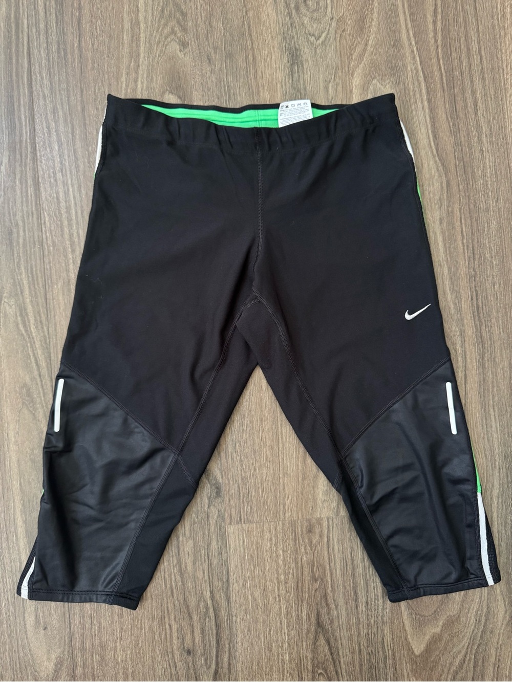 Nike Black Capri Workout Pants with Green Waistband and White Accents